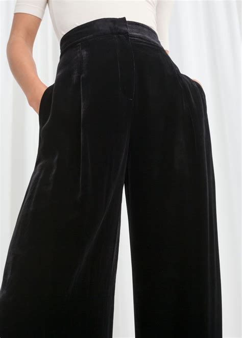 high waisted black velvet pants.